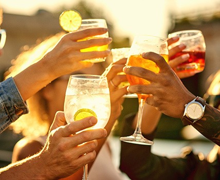 People toasting at sunset 