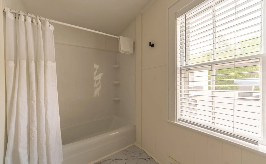 Bathroom with a tub shower