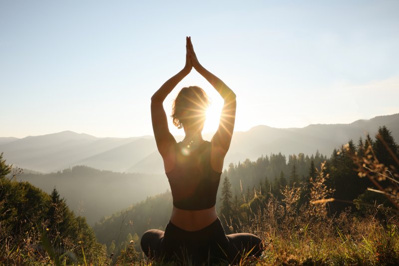 young woman doing yoga in the White Mountains