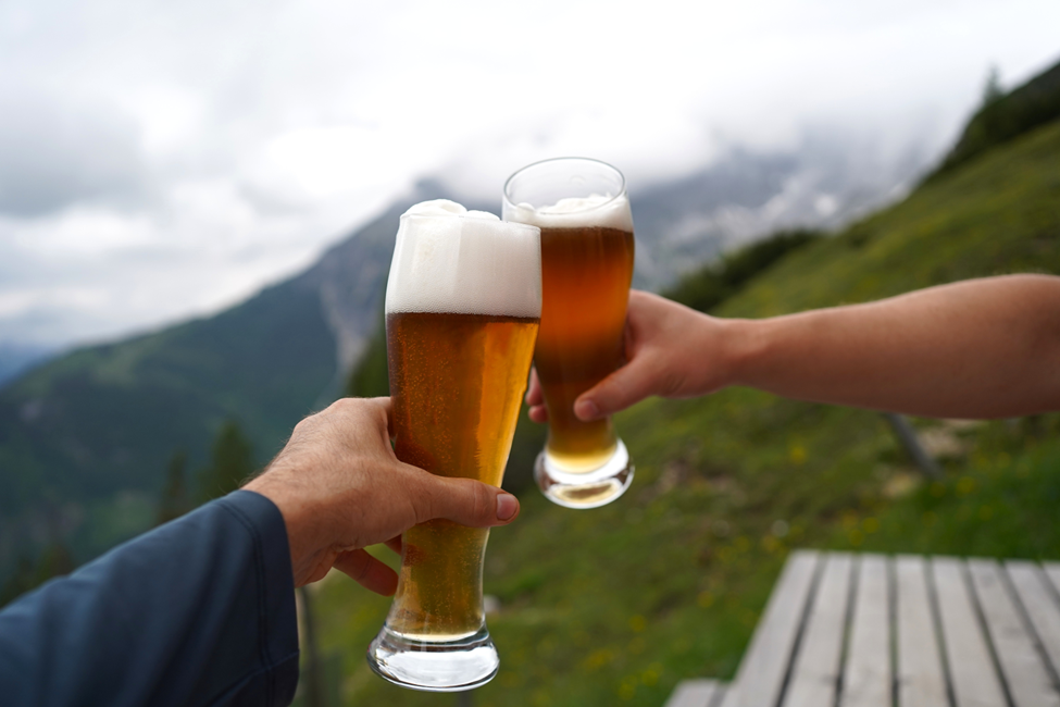 young couple toasting beers