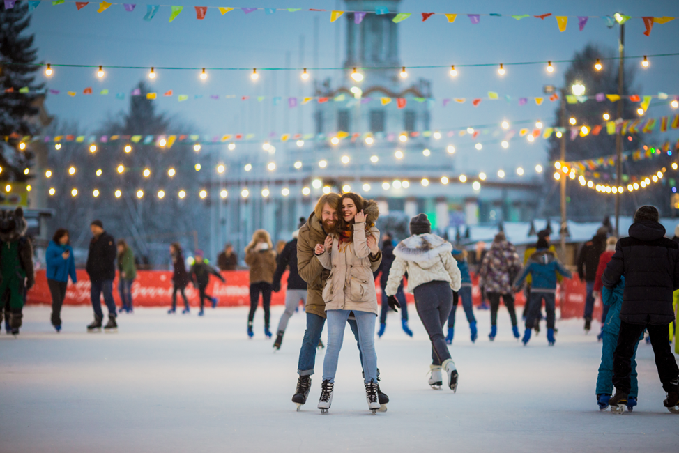 young couple ice skating in North Conway